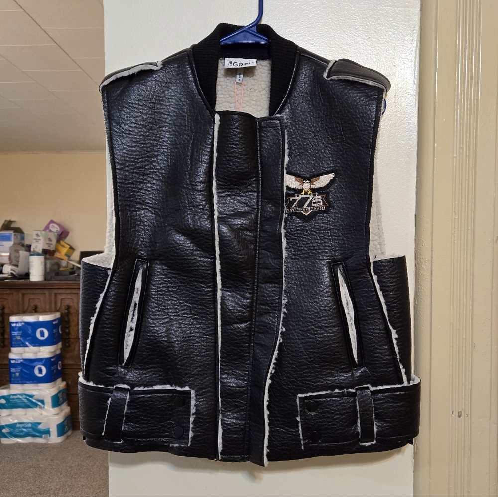 Brand new!! NWT The Greii boutique black vegan leather & sherpa vest size small